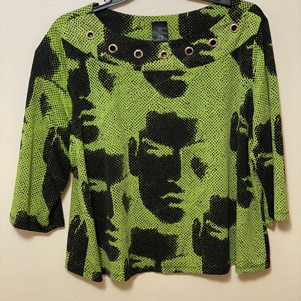2-pc Face fashion blouse w/ silver embellishments.